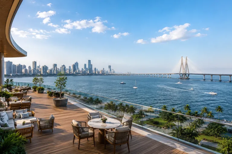 Artistic impression of an elevated deck with outdoor seating facing the sea